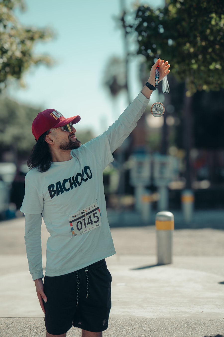 Runner holding up a finisher medal